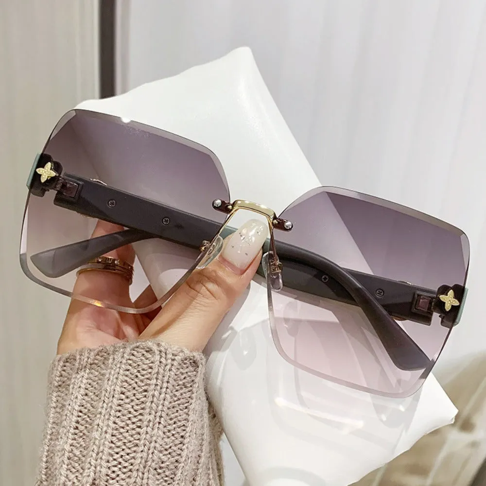 Wholesale Frameless Trimmed Trendy Sunglasses